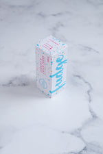 Load image into Gallery viewer, A white box stands upright on a neutral background. Large bright blue lettering states &#39;fudge&#39; and is surrounded by bright blue and cerise pink paint splashes. A messy circled logo for The Counter and the words &#39;Cookies &amp; Cream fudge with dark chocolate&#39; are written in cerise pink block lettering.
