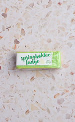 Load image into Gallery viewer, Bar of springbokkie fudge on a terrazzo countertop
