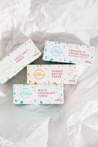 Four boxes of fudge in branded, colourful packaging