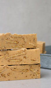 Large bars of gingerbread fudge, stacked on top of each other.