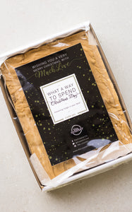 One kilogram slab of gingerbread fudge in a sturdy white cardboard tray - finished with a black and gold 'Merry Christmas' sticker.