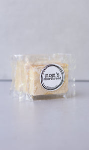 Mom's shortbread - traditional Scottish butter shortbread, packaged in cellophane and finished with a black sticker that says 'Mom's Shortbread'.