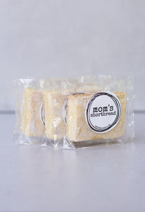 Mom's shortbread - traditional Scottish butter shortbread, packaged in cellophane and finished with a black sticker that says 'Mom's Shortbread'.