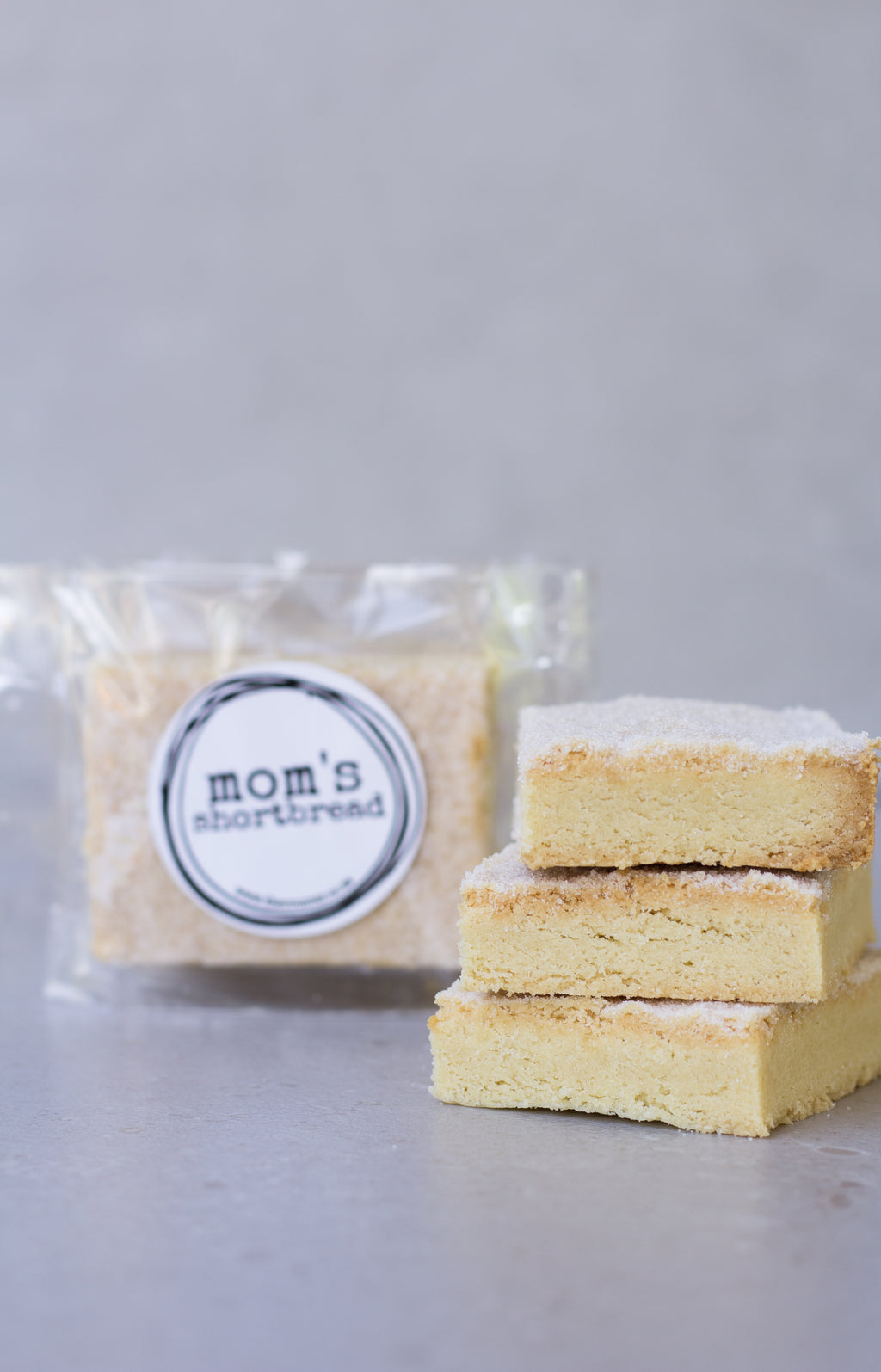 Mom's shortbread - traditional Scottish butter shortbread, packaged in cellophane and finished with a black sticker that says 'Mom's Shortbread'.