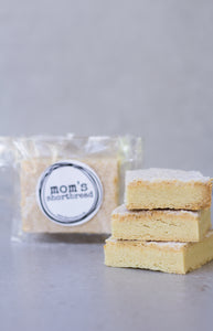 Mom's shortbread - traditional Scottish butter shortbread, packaged in cellophane and finished with a black sticker that says 'Mom's Shortbread'.