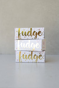 Gold foiled white box filled with gingerbread fudge.