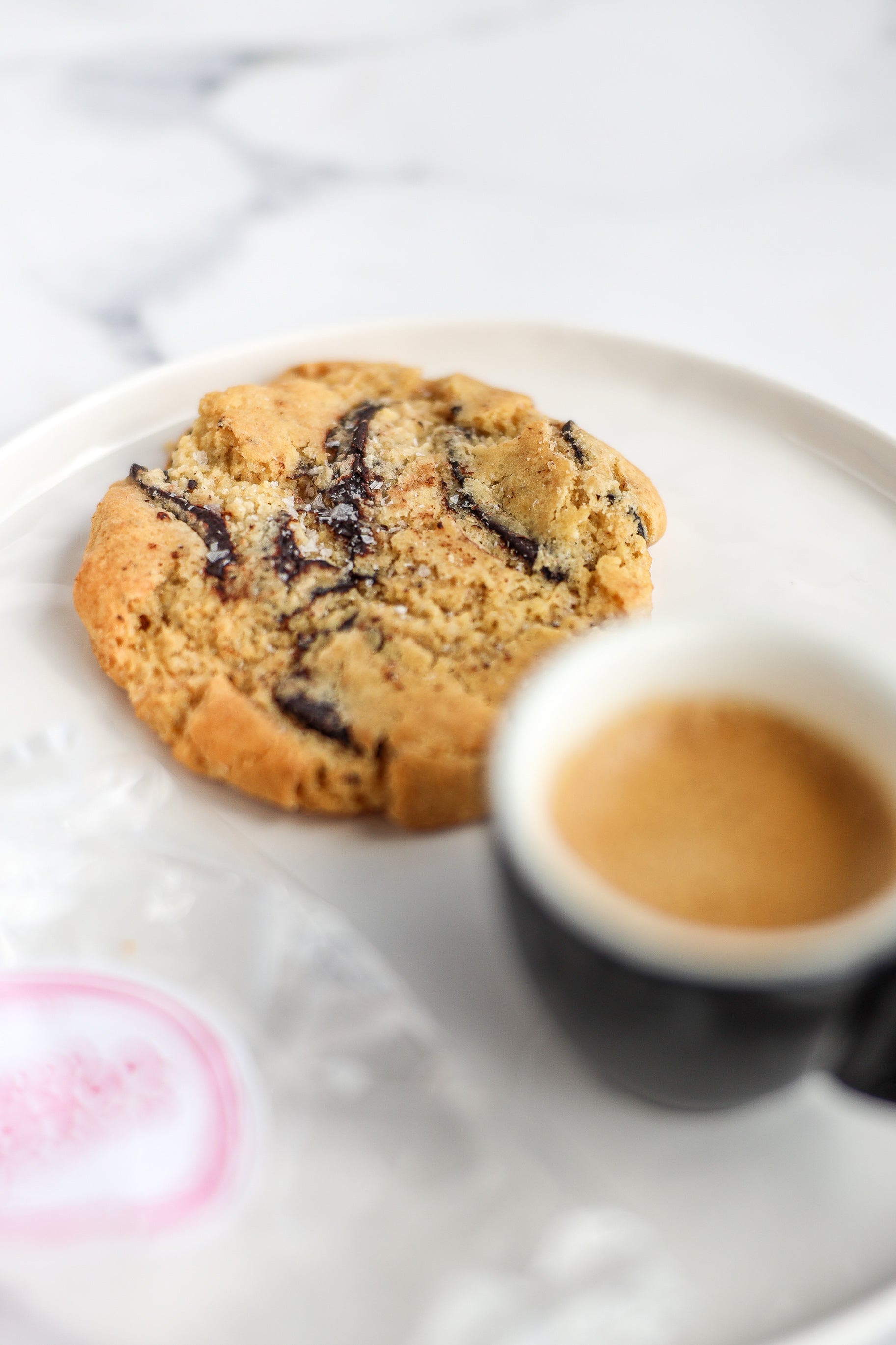 Salted dark chocolate cookies served with an espresso