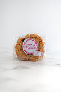 Gluten-free, vegan peanut butter and dark chocolate cookie in branded packaging